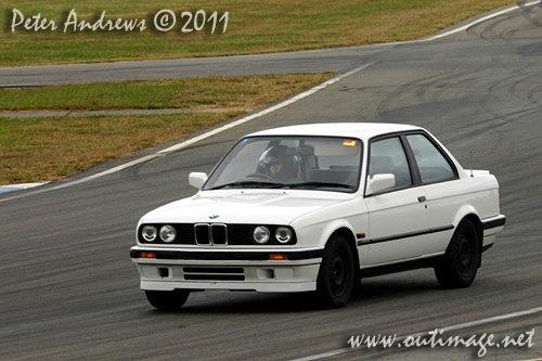Not just for the boys! A young Asian woman driving an E30 BMW 318is at Wakefield Park Goulburn, NSW Australia. Circuit Club Day April 25, 2011. Photo copyright Peter Andrews, Outimage Australia.