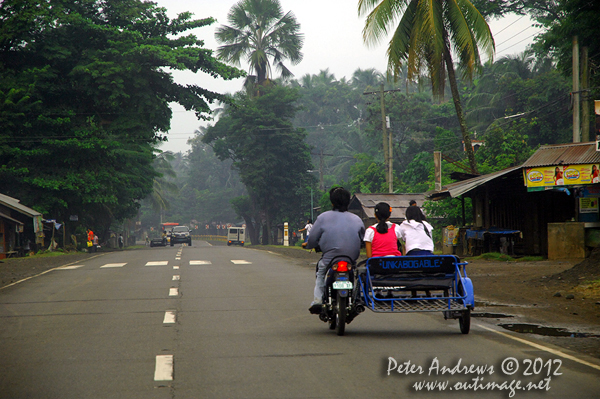 Off to school on the highway to Kidapawan City, Davao del Sur Province, Mindanao, Philippines. Photo copyright Peter Andrews, Outimage Australia.