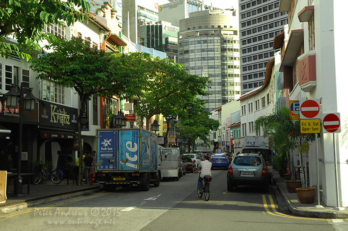 The evening view down Circular Road looking towards the buildings of Singapore's business district of Raffles Place. Photo © Peter Andrews / Outimage. Walking from Circular Road to Chinatown in Singapore as the city prepares for the Lunar New Year.