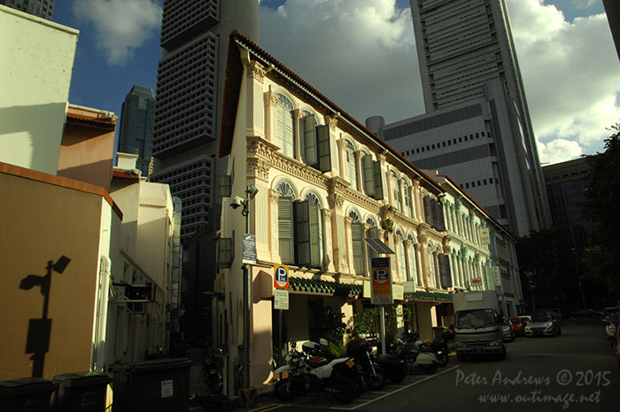 Mixed architecture of the old overshadowed with the new, along Lorong Telok in the Boat Quay area of Singapore city. Photo © Peter Andrews / Outimage. Walking from Circular Road to Chinatown in Singapore as the city prepares for the Lunar New Year.