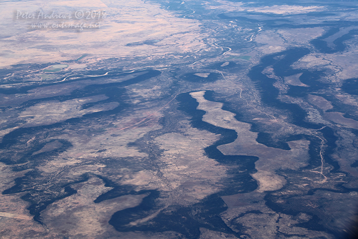 The Flinders River passes through outback Queensland north of the town of Hughenden, at the foot of a high plateu landscape near Porcupine Gorge. 20°30'36.6"S 144°09'48.3"E. High altitude shots from a flight between Sydney Australia and Manila, Philippines.