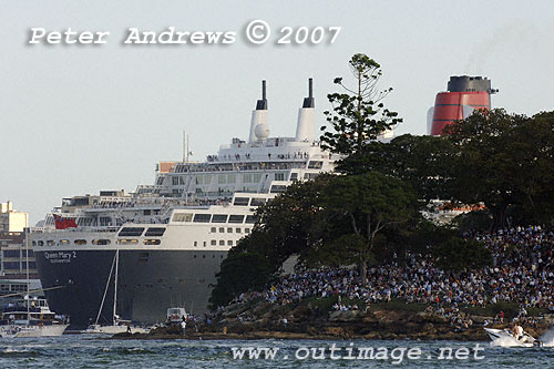 The crowd at Mrs Macquaries Point with the Queen Mary 2 in the background, gathered to see the arrival of the Queen Elizabeth 2 and the evening fireworks to celebrate the combined presence of the Cunard Queens in Sydney.