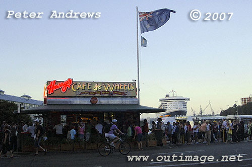 Harry's Cafe de Wheels at Woolloomooloo Bay with the QM2 in the background.