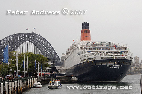 QE2 at the Overseas Passenger Terminal at Circular Quay Sydney with the Sydney Harbour Bridge in the background.