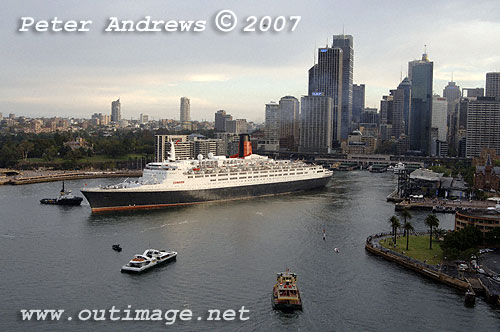 Sydney commuter ferries pause for the QE2 in Circular Quay Sydney.