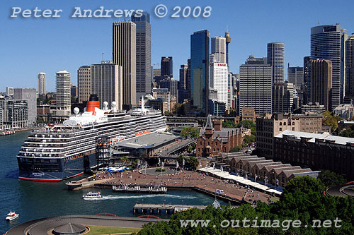 Queen Victoria at the Overseas Passenger Terminal at Circular Quay with the Sydney city skyline in the background.