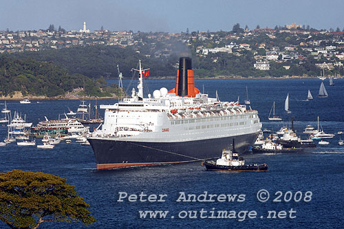 Queen Elizabeth II turning towards Circular Quay on Sydney Harbour.