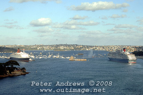A historic moment on Sydney Harbour where Queen Elizabeth II on her twenty-ninth and final visit to Sydney before decommissioning is left of Fort Denison. To the right, Queen Victoria is seen leaving Sydney Harbour after her first visit during a maiden world voyage.