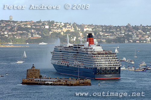 Queen Victoria behind Fort Denison turns towards passage to open sea on Sydney Harbour.