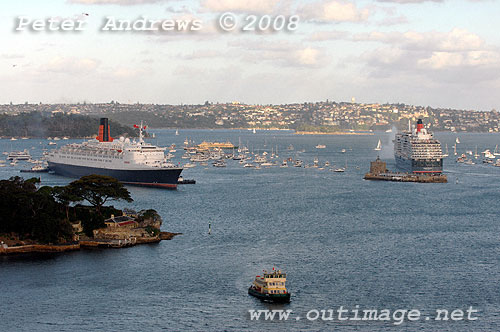 Queen Elizabeth II commences passage to Circular Quay as Queen Victoria turns to open sea beyond Fort Denison.