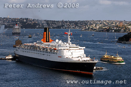 Queen Elizabeth II steaming to Circular Quay with tugs and a Manly ferry while Queen Victoria in the background is leaving Sydney for passage to Brisbane.