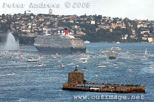 Queen Victoria rounding Bradleys Head on Sydney Harbour with Fort Denison in the foreground.