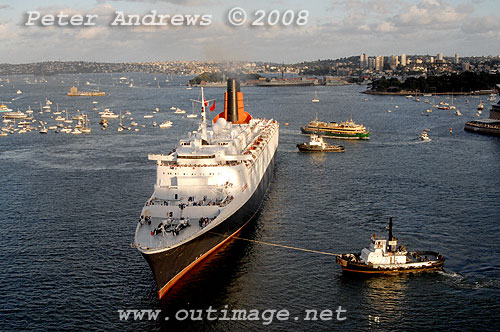 Queen Elizabeth II commencing a turn off the Sydney Opera House to go astern into Circular Quay.