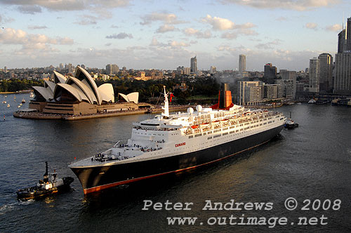 Queen Elizabeth II in position to go astern into Circular Quay with the Sydney Opera House in the background.