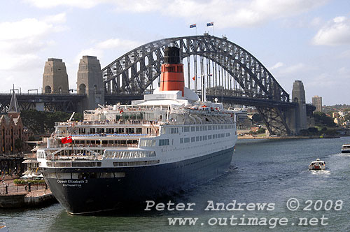 Queen Elizabeth 2 at the Overseas Passenger Terminal, Circular Quay Sydney with the Sydney Harbour Bridge in the background.