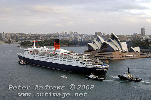 Queen Elizabeth 2 in front of the Sydney Opera House on Sydney Harbour.