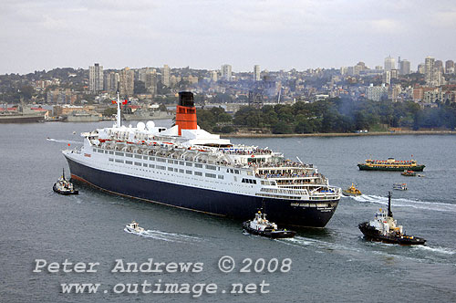 Queen Elizabeth 2 with Mrs Macquaries Point and Garden Island Navel Dockyard in the background on Sydney Harbour.