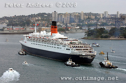 Queen Elizabeth 2 off Mrs Macquaries Point with Garden Island Navel Dockyard in the background on Sydney Harbour.