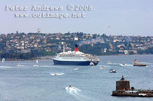 Queen Elizabeth 2 turning around Bradleys Head on Sydney Harbour.