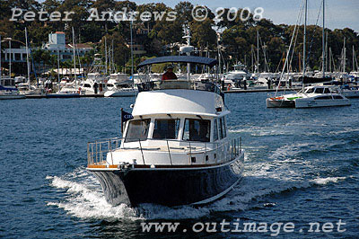 A Grand Banks 47 Eastbay on Pittwater with the Royal Motor Yacht Club in the background.