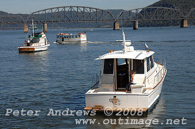 Cinamon Girl, a 2004 43 Eastbay with the Brooklyn Danger Island ferry and the Hawkesbury River Railway Bridge in the background.