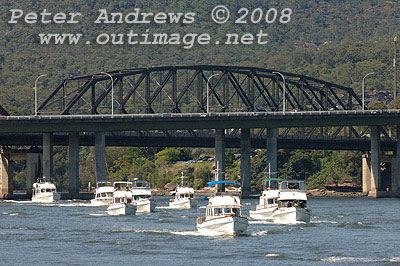 Grand Banks Rendezvous fleet motoring up the Hawkesbury River after passing under the Pacific Highway and freeway bridges.