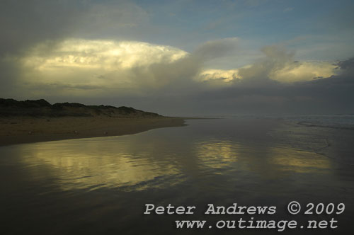Illawarra's Corrimal Beach at sunset looking towards Bellambi Point and a storm cell passing over Sydney to the north. Photo copyright Peter Andrews, Outimage.