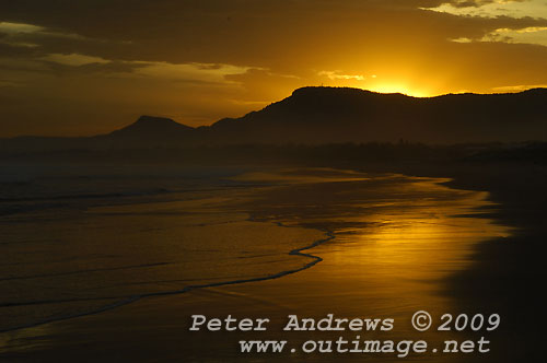 Illawarra's Corrimal Beach at sunset with Mount Kembla left and Mount Keira right, in the background. Photo copyright Peter Andrews, Outimage.