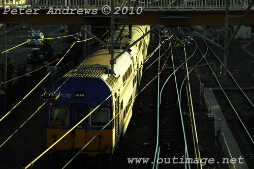 Evening train to Sydney leaving Newcastle. Photo copyright Peter Andrews, Outimage Publications.
