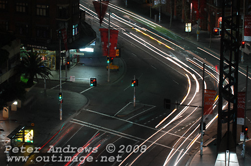 Late night traffic flowing from George Street into Broadway at Sydney's Railway Square. Photo copyright Peter Andrews 2008, Outimage Publications.