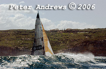 Geoff Lavis' Inglis 50 UBS Wild Thing, behind a wave at the heads after the start of the 2006 Sydney to Gold Coast Yacht Race.
