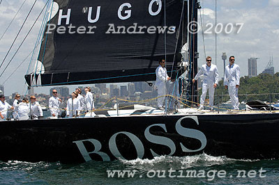 The crew on Tony Fisher's Volvo 60 Hugo Boss dressed up in white Hugo Boss suits, sailing out on Sydney Harbour.