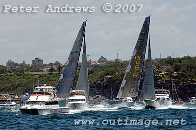 Mike Slade's 30 metre maxi City Index Leopard just ahead of Bob Oatley's Wild Oats approaching the inner mark at the heads.