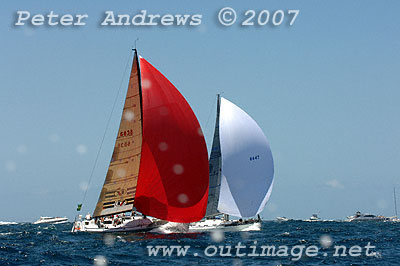 Bruce Taylor's Chutzpah with its red spinnaker and David Beak's Beneteau First 44.7 Mr Beak's Ribs.