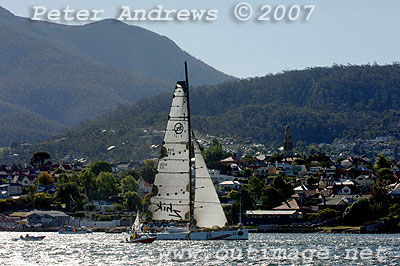 Ichi Ban working down to the finishing line off Sandy Bay with Mount Wellington in the background.