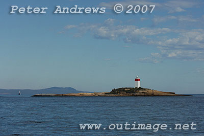 The Iron Pot Lighthouse at the mouth of the Derwent with Rosebud out on Storm Bay in the background.