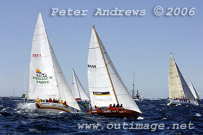 The Rum Consortium's Phillip's Foote Witchdoctor sailing out the heads with Koomooloo after the start of the 2006 Rolex Sydney Hobart.