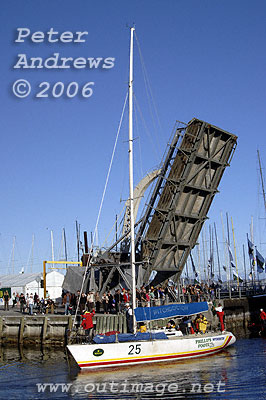 Phillip's Foote Witchdoctor passes under the drawbridge to arrive at Hobart's Constitution Dock after completing the 2006 Rolex Sydney Hobart Yacht Race.