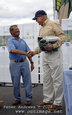 Lou Abrahms receiving battle flags from Cruising Yacht Club of Australia's Commodore Geoff Lavis. For the 2006 Rolex Sydney Hobart, Lou's Sydney 38 Challenge achieved first (and third overall) in IRC Division D as well as first in the Sydney 38 one design class.