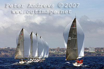 A neat line of five Farr 40's under spinnaker sailing towards the sea cliff shoreline of the eastern suburbs of Sydney, during the 2007 Rolex Trophy One Design Series. Photo copyright Peter Andrews.