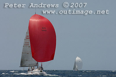 Ivan Wheen's Sputnik with the red spinnaker and Ivan Resnekov's Impi in the background.