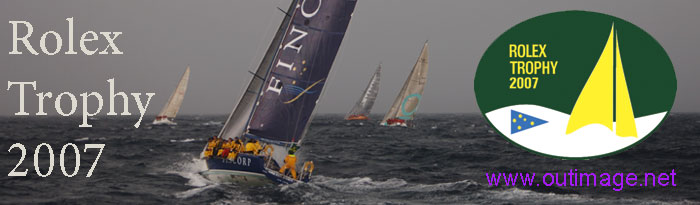 The Outimage Publications, Rolex Trophy 2007 banner contains a background image of four yachts working their way into a stiff breeze, a rain squall and the back of a storm, well offshore Sydney. The banner also contains the official Rolex Trophy Banner above the Outimage website URL of w w w dot outimage dot net to the right, boats sailing into the storm in the centre and white text overlaid on the left, quote, Rolex Trophy 2007.