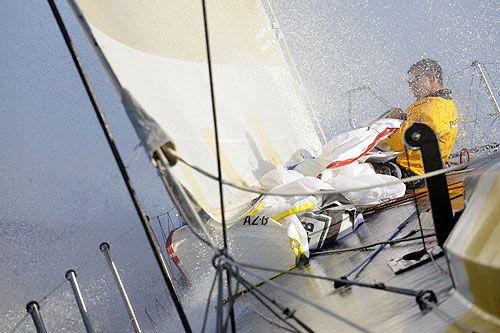 Bowman Michael Joubert (SA) hauls the spinnaker in onboard Team Russia's Kosatka, whilst training for the in-port race in Alicante, Spain. Photo copyright Rick Tomlinson - Volvo Ocean Race.