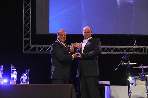 Captain Goran Soderdahl left, Owners representative of Wallenius Wilhelmsen Logistics South Africa, presents the seamanship award to Delta Lloyd's Martin Watts from Great Britain, at the leg 1 prize giving ceremony in Cape Town, South Africa. Watts made a critical repair to the mast after one of the jumper spreaders was broken. The jury for the prize found this to be an extraordinary repair that would be very difficult to effect at the top of the mast in offshore conditions. Photo copyright Rick Tomlinson / Volvo Ocean Race.
