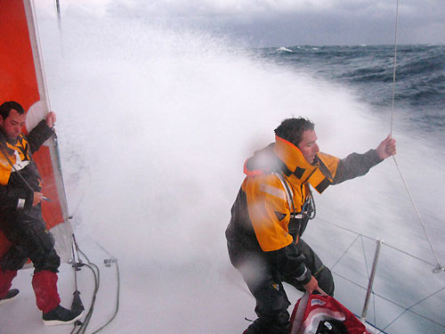 Iker Martinez left and Pepe Ribes hang on as a huge wave hits Telefonica Blue, on leg 2 of the Volvo Ocean Race, from Cape Town, South Africa to Cochin, India. Photo copyright Gabriele Olivo / Telefonica Blue / Volvo Ocean Race.