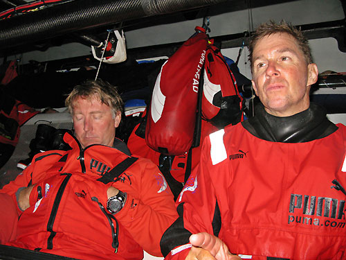 PUMA Ocean Racing Navigator Andrew Cape sleeps, whilst skipper Ken Read battles to stay awake at the navigation station, on leg 2 of the Volvo Ocean Race, from Cape Town, South Africa to Cochin, India. Photo copyright Rick Deppe / PUMA Ocean Racing / Volvo Ocean Race. 
