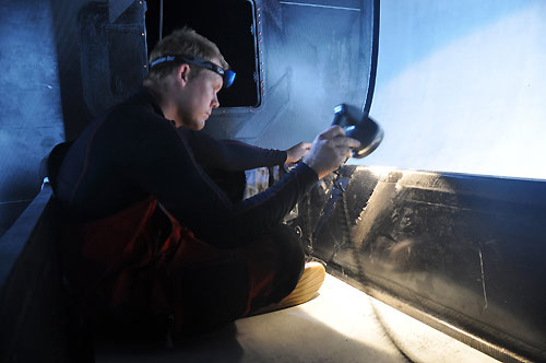 Casey Smith from Australia. The crew of PUMA Ocean Racing make repairs to their boat after sustaining serious structural damage in rough seas, for the second time in 24 hours. Photo copyright Rick Deppe / PUMA Ocean Racing / Volvo Ocean Race.