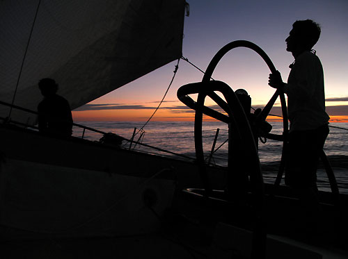 Helming at sunset onboard Team Russia, on leg 2 of the Volvo Ocean Race, from Cape Town, South Africa to Cochin, India. Photo copyright Mark Covell / Team Russia / Volvo Ocean Race.