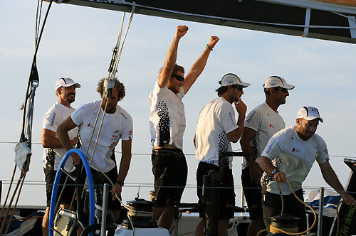 The crew on Telefonica Black, skippered by Fernando Echavarri from Spain, celebrate finishing leg 2 of the Volvo Ocean Race from Cape Town, South Africa to Cochin, India. They crossed the line at 12:00:20 GMT, securing 5 points for the finish and 6.5 points overall for the leg. Photo copyright Dave Kneale / Volvo Ocean Race. 