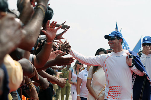 Ericsson 4 skipper Torben Grael make his way down the dockside, cheered on by huge crowds, for the start of leg 3 from Cochin, India to Singapore. Photo copyright Dave Kneale / Volvo Ocean Race.